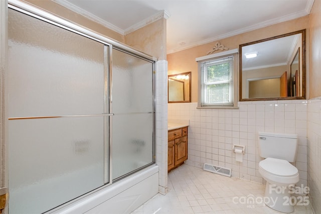 319 Glenhaven Dr, Charlotte, NC 28214 - full bath featuring vanity, tile walls, tile patterned flooring, shower / bath combination with glass door, and crown molding