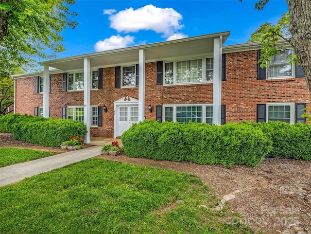 65 Brookside Dr Unit 35, Hendersonville, NC 28792 - view of front of property with brick siding and a front lawn