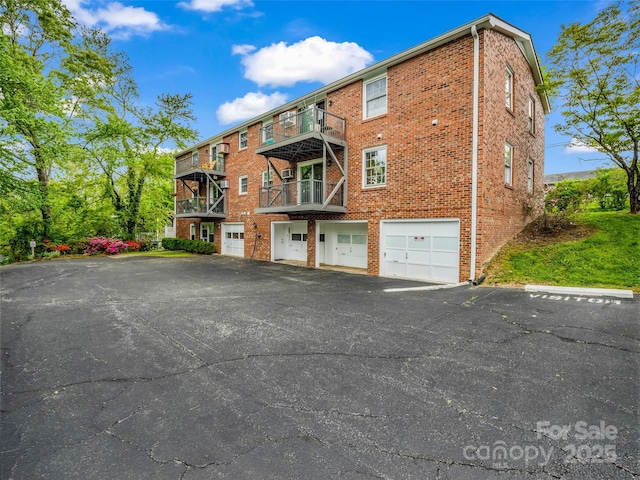 65 Brookside Dr Unit 35, Hendersonville, NC 28792 - view of apartment building / complex featuring an attached garage and driveway