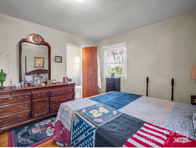 bedroom featuring wood finished floors