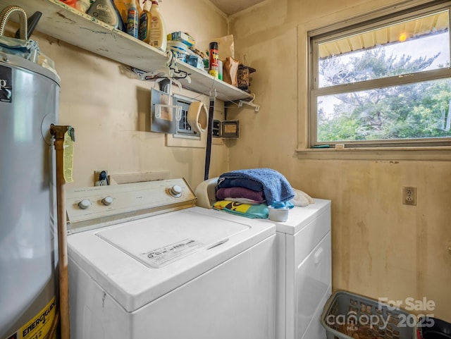 laundry room featuring gas water heater and washing machine and clothes dryer