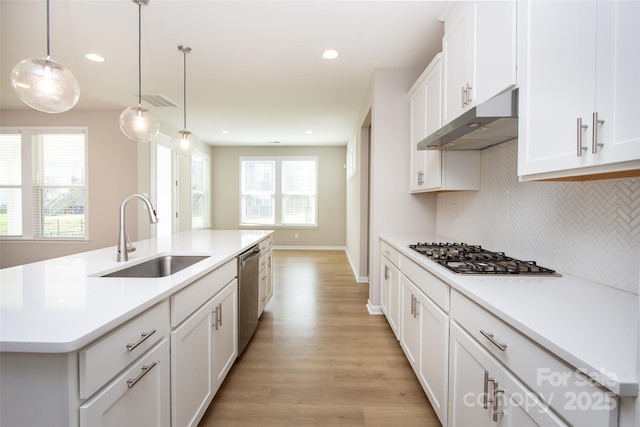 256 W Waterlynn Rd, Mooresville, NC 28117 - kitchen with a sink, under cabinet range hood, gas cooktop, dishwasher, and tasteful backsplash