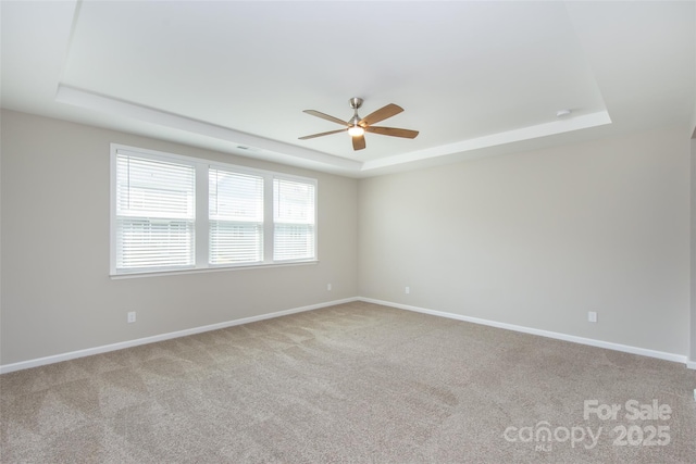 256 W Waterlynn Rd, Mooresville, NC 28117 - unfurnished room with a tray ceiling, ceiling fan, light colored carpet, and baseboards