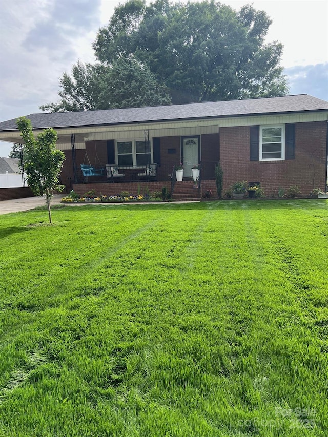 202 Kenwood Ave, Cherryville, NC 28021 - ranch-style home with a front lawn and brick siding