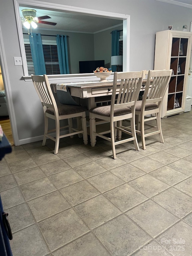 202 Kenwood Ave, Cherryville, NC 28021 - dining area featuring ornamental molding, stone tile floors, baseboards, and ceiling fan