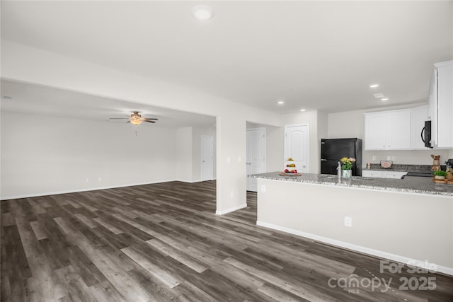 155 Trail Wood Ct, Salisbury, NC 28146 - kitchen featuring black appliances, white cabinets, recessed lighting, dark wood-style flooring, and light stone countertops