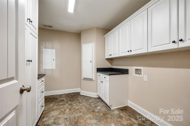 2027 Ellison Dr, Rock Hill, SC 29730 - washroom featuring cabinet space, stone finish flooring, and washer hookup