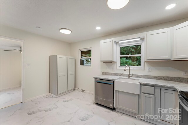 kitchen with appliances with stainless steel finishes, light marble finish flooring, gray cabinetry, baseboards, and recessed lighting