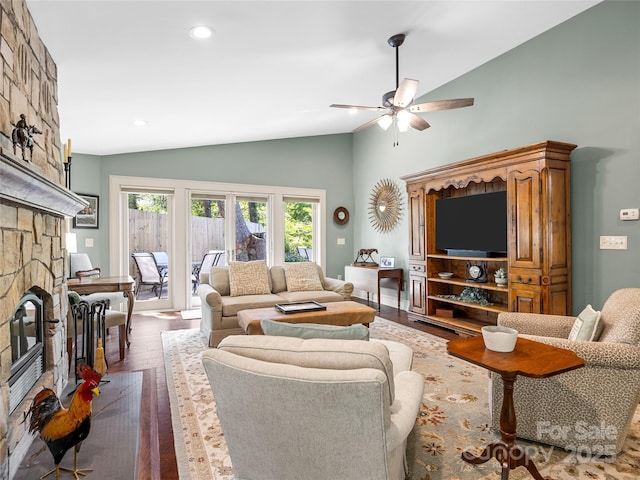 living area featuring a fireplace, dark wood finished floors, ceiling fan, recessed lighting, and high vaulted ceiling