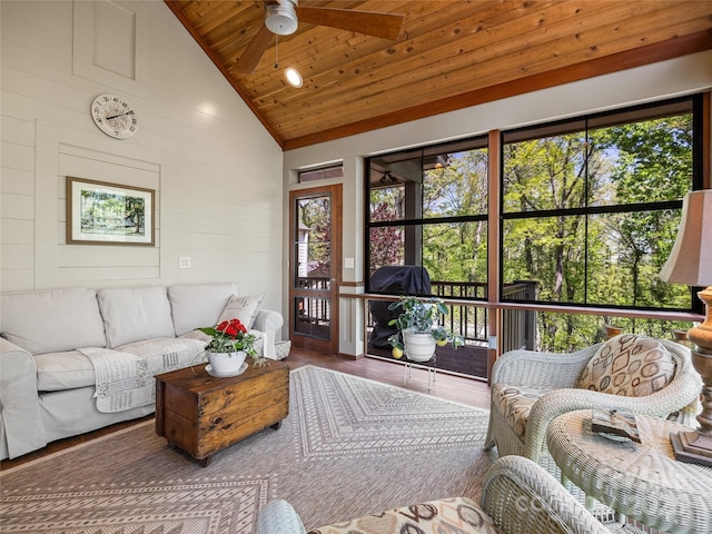 living room with wooden ceiling, a ceiling fan, wood finished floors, and high vaulted ceiling