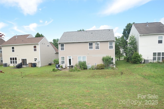 6105 Follow The Trl, Indian Trail, NC 28079 - rear view of house featuring central air condition unit and a yard
