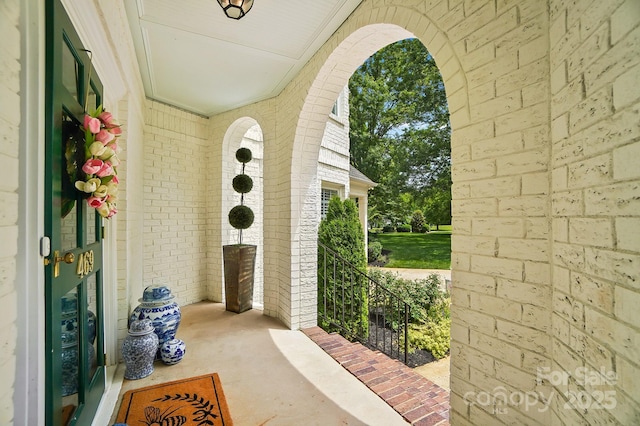 469 Valley Run Dr, Waxhaw, NC 28173 - view of exterior entry with a porch and brick siding