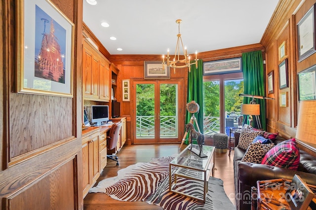 469 Valley Run Dr, Waxhaw, NC 28173 - living area with ornamental molding, a chandelier, wood finished floors, wooden walls, and recessed lighting