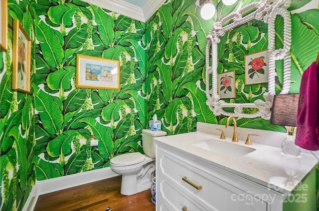 469 Valley Run Dr, Waxhaw, NC 28173 - half bath with wallpapered walls, ornamental molding, wood finished floors, vanity, and toilet