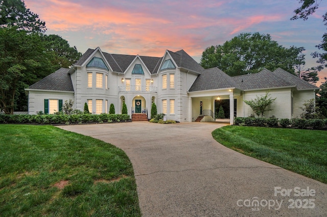 469 Valley Run Dr, Waxhaw, NC 28173 - french country style house featuring a lawn, a balcony, and driveway