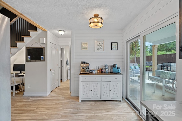8007 Maxwelton Dr, Huntersville, NC 28078 - interior space with a textured ceiling, light wood-style floors, and stairway