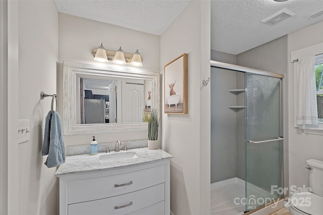 8007 Maxwelton Dr, Huntersville, NC 28078 - full bath with toilet, vanity, a textured ceiling, and a shower stall