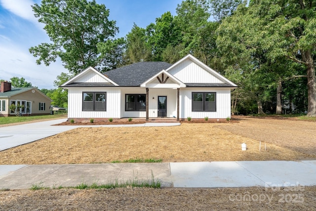 315 W Hoke St W, Landis, NC 28088 - modern farmhouse style home with a shingled roof and board and batten siding