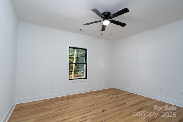 315 W Hoke St W, Landis, NC 28088 - unfurnished room with light wood-style flooring, a ceiling fan, and baseboards