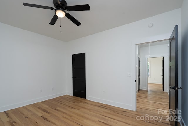 315 W Hoke St W, Landis, NC 28088 - unfurnished room featuring light wood-type flooring, a ceiling fan, and baseboards