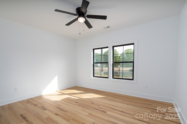 315 W Hoke St W, Landis, NC 28088 - empty room featuring light wood-style floors, baseboards, and a ceiling fan