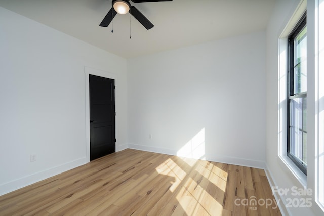315 W Hoke St W, Landis, NC 28088 - unfurnished room with plenty of natural light, light wood-style flooring, and a ceiling fan