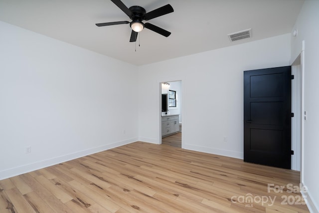 315 W Hoke St W, Landis, NC 28088 - unfurnished bedroom featuring light wood finished floors, baseboards, ensuite bath, and ceiling fan