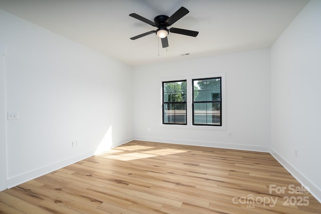 315 W Hoke St W, Landis, NC 28088 - empty room featuring wood finished floors, ceiling fan, and baseboards