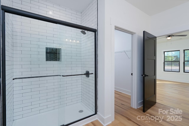315 W Hoke St W, Landis, NC 28088 - full bath with a shower stall, wood finished floors, and a ceiling fan