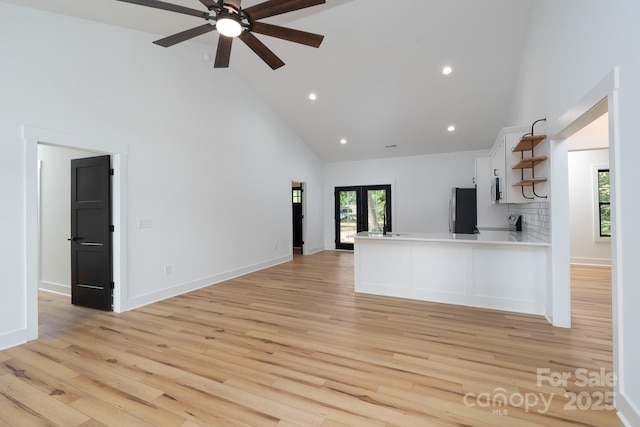 315 W Hoke St W, Landis, NC 28088 - unfurnished living room featuring high vaulted ceiling, plenty of natural light, a ceiling fan, light wood finished floors, and recessed lighting
