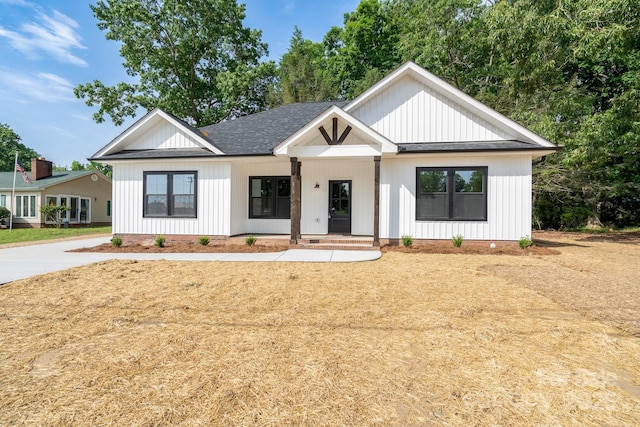 315 W Hoke St W, Landis, NC 28088 - modern inspired farmhouse with a shingled roof, board and batten siding, and covered porch