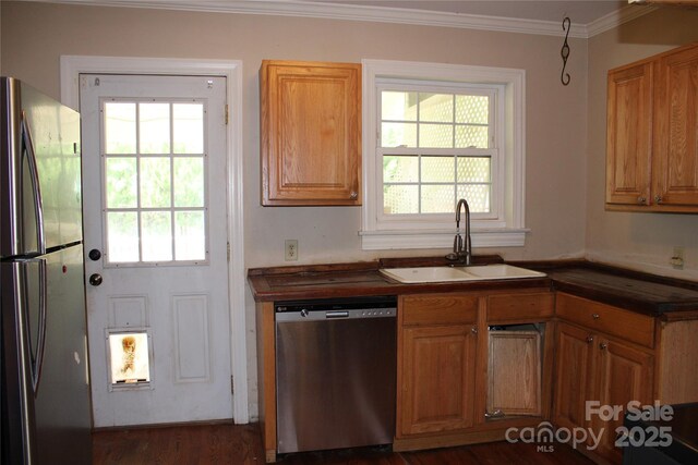 426/432 Maple St, Brevard, NC 28712 - kitchen featuring stainless steel appliances, a sink, dark countertops, crown molding, and dark wood-type flooring