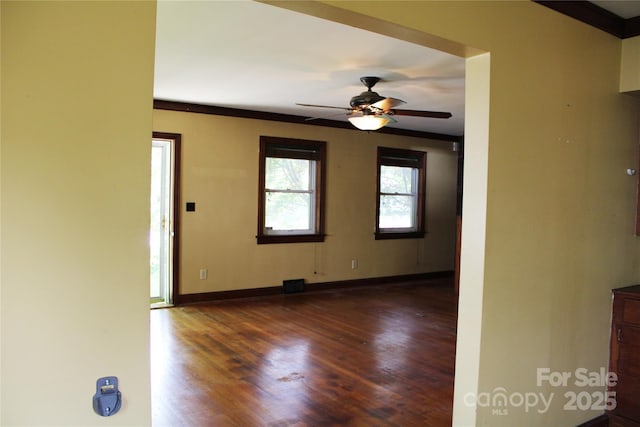 426/432 Maple St, Brevard, NC 28712 - empty room with dark wood-style floors, ceiling fan, and baseboards