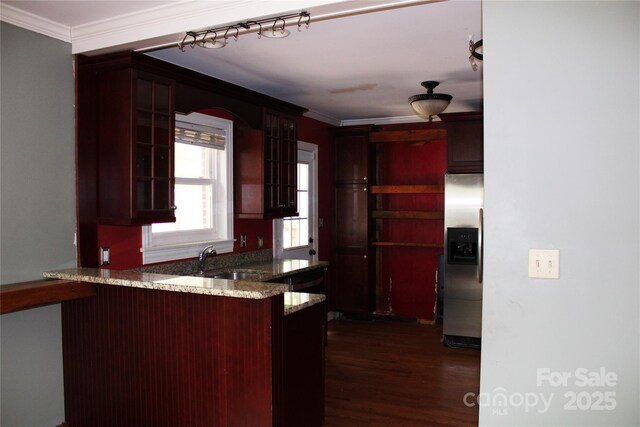 426/432 Maple St, Brevard, NC 28712 - kitchen featuring stainless steel fridge with ice dispenser, a sink, ornamental molding, glass insert cabinets, and a peninsula