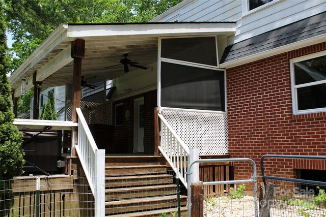 426/432 Maple St, Brevard, NC 28712 - view of exterior entry featuring brick siding and a ceiling fan