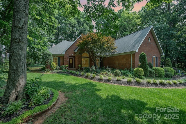 5208 Black Oak Ln, Waxhaw, NC 28173 - view of front of home featuring brick siding, a front yard, and roof with shingles