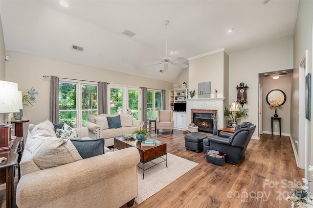 5208 Black Oak Ln, Waxhaw, NC 28173 - living area featuring a ceiling fan, high vaulted ceiling, wood finished floors, a fireplace, and baseboards