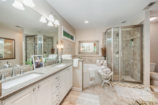 5208 Black Oak Ln, Waxhaw, NC 28173 - full bath featuring a garden tub, a shower stall, double vanity, toilet, and tile patterned floors