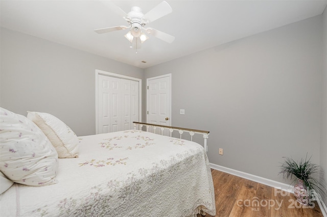 5208 Black Oak Ln, Waxhaw, NC 28173 - bedroom with baseboards, wood finished floors, a closet, and a ceiling fan