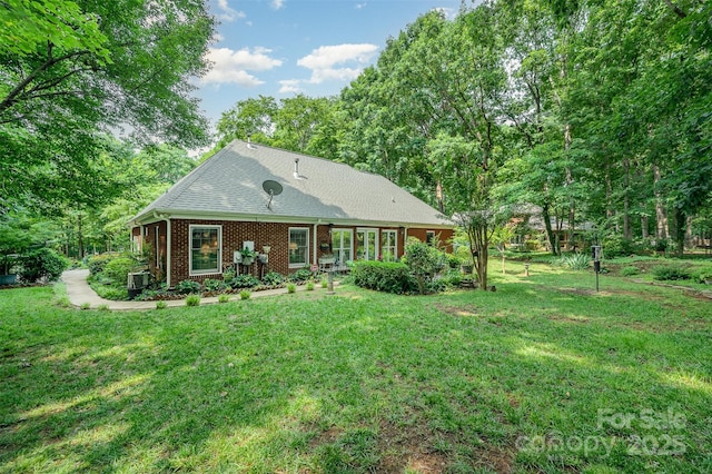5208 Black Oak Ln, Waxhaw, NC 28173 - back of property with a yard and brick siding