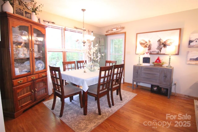 2815 Penny Park Dr, Gastonia, NC 28052 - dining space with wood finished floors, baseboards, and a chandelier