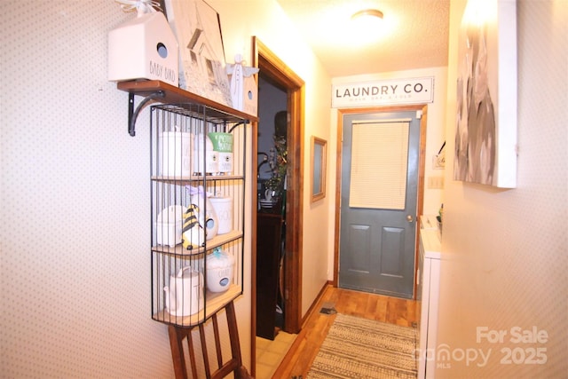 2815 Penny Park Dr, Gastonia, NC 28052 - entryway with light wood-style flooring, wallpapered walls, and baseboards