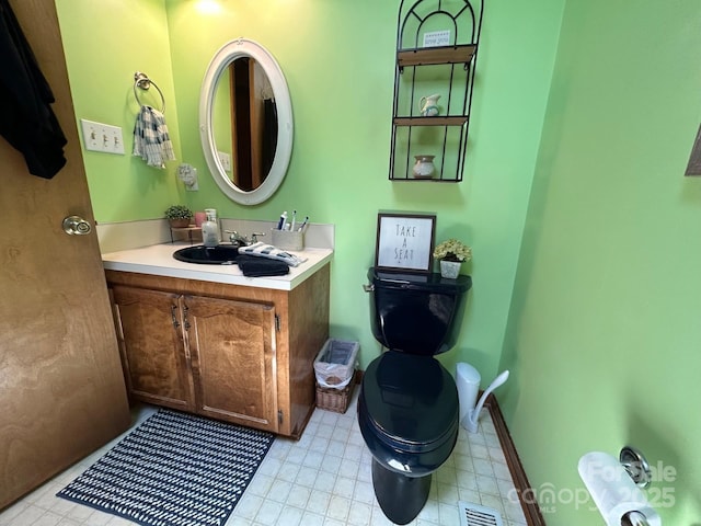 2815 Penny Park Dr, Gastonia, NC 28052 - half bathroom featuring toilet, vanity, and tile patterned floors