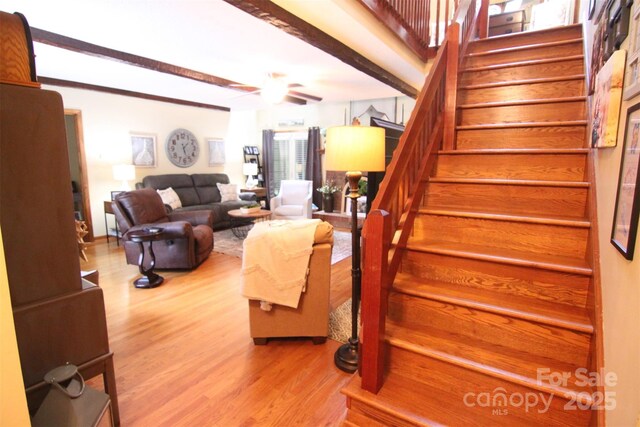 2815 Penny Park Dr, Gastonia, NC 28052 - living room with stairway, wood finished floors, ceiling fan, and beamed ceiling