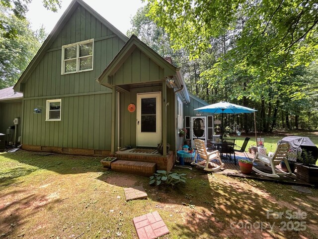 2815 Penny Park Dr, Gastonia, NC 28052 - view of front of property with cooling unit, a front lawn, and a patio