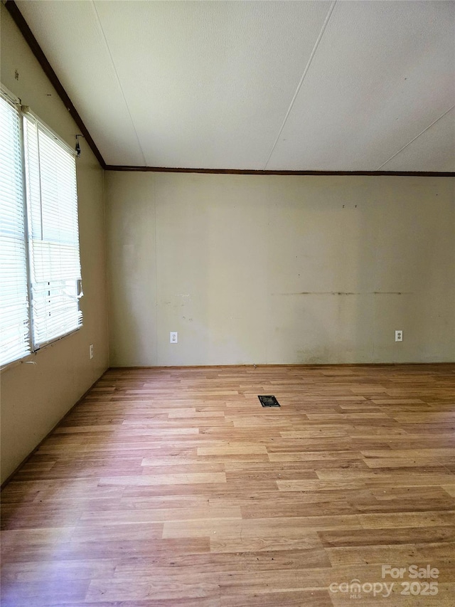 219 Watterson Rd, Grover, NC 28073 - empty room with crown molding and light wood-style flooring