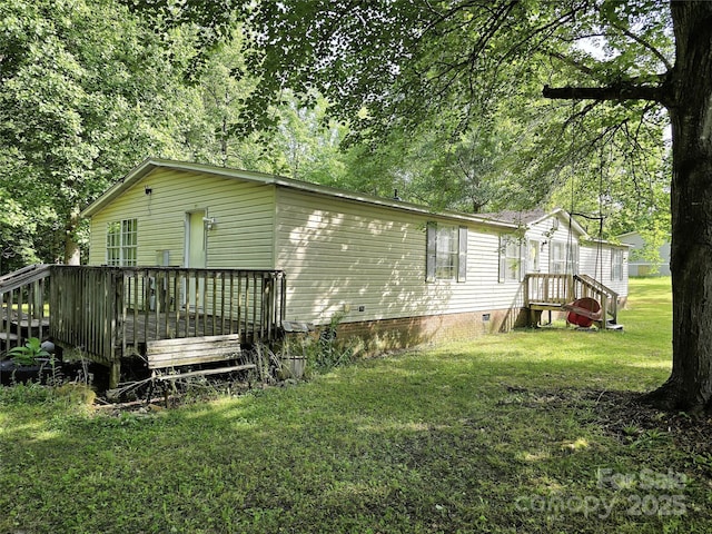 219 Watterson Rd, Grover, NC 28073 - back of property with crawl space, a lawn, and a deck