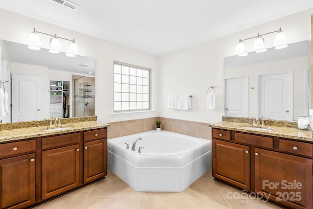 3918 Halcyon Dr, Huntersville, NC 28078 - bathroom featuring two vanities, a stall shower, and tile patterned floors