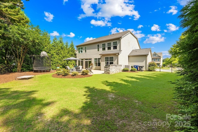 3918 Halcyon Dr, Huntersville, NC 28078 - rear view of property featuring a trampoline and a patio