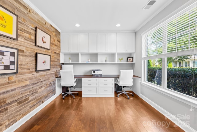 3918 Halcyon Dr, Huntersville, NC 28078 - office area with wooden walls, built in study area, baseboards, wood finished floors, and ornamental molding